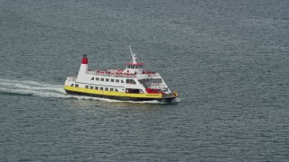 AX147_320 - 6k aerial stock footage tracking a ferry carrying passengers and vehicles, Portland, Maine