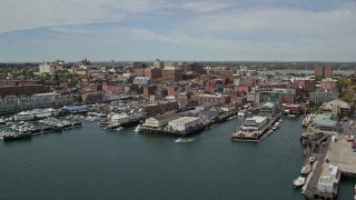 AX147_321E - 6K aerial stock footage flying by docked cruise ship, piers and downtown, autumn, Portland, Maine