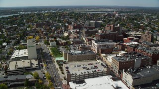 AX147_334 - 6k aerial stock footage flying over downtown office buildings, autumn, Portland, Maine
