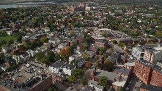 AX147_336 - 6k aerial stock footage flying by neighborhood, autumn, Portland, Maine