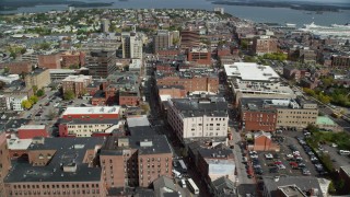 AX147_338 - 6k aerial stock footage flying over Congress Street, approaching downtown buildings, Portland, Maine