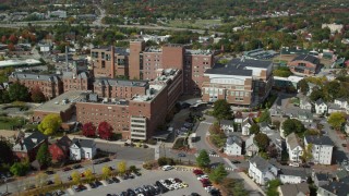 AX147_353 - 6k stock footage aerial video orbiting Maine Medical Center, autumn, Portland, Maine