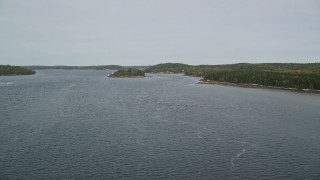 AX147_399E - 6K aerial stock footage flying over Kennebec River, approach Perkins Island, Marr Island, Georgetown, Maine