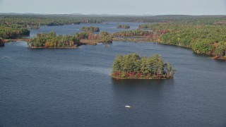 AX148_025 - 6K aerial stock footage of forests on small islands, Pemaquid Pond, McCurdy Pond, autumn, Damariscotta, Maine