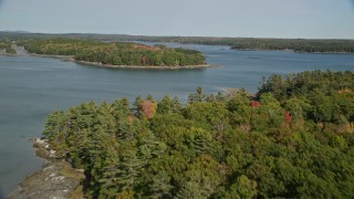 AX148_029 - 6k aerial stock footage approaching forested islands, The Narrows, autumn, Waldoboro, Maine