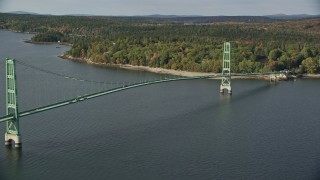 AX148_139E - 6K aerial stock footage orbiting the Deer Isle Bridge in autumn, Deer Isle Bridge, Maine