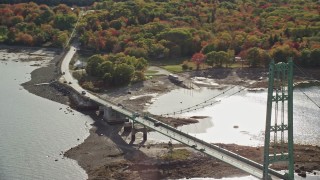 AX148_144 - 6K aerial stock footage tracking cars on Deer Isle Bridge, Deer Isle Road, autumn, Little Deer Isle, Maine