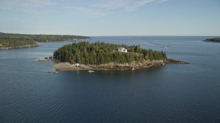 AX148_165E - 5.5K aerial stock footage approaching Bear Island Light, Bear Island, Maine
