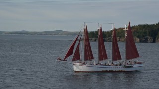 AX148_196 - 5.5K aerial stock footage flying by sailing ship in Bar Harbor, Maine