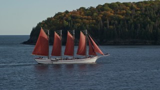 AX148_199 - 5.5K aerial stock footage of a sailing ship in Bar Harbor, Maine