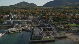 AX148_201 - 5.5K aerial stock footage approaching Harborside Hotel, Spa and Marina in autumn, Bar Harbor, Maine