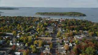 AX148_206 - 5.5K stock footage aerial video flying over Main Street in a coastal town in autumn, Bar Harbor, Maine