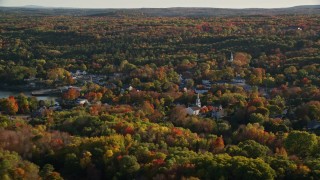 AX149_017 - 5.5K aerial stock footage flying by quaint coastal town among fall foliage, Blue Hill, Maine