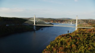 AX149_098 - 5.5K aerial stock footage flying over Penobscot river, approaching Penobscot Narrows Bridge, autumn, Maine