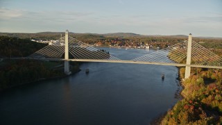 AX149_098E - 5.5K aerial stock footage flying over Penobscot river, approaching Penobscot Narrows Bridge, autumn, Maine