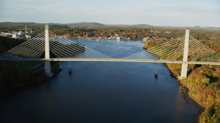 AX149_099 - 5.5K aerial stock footage flying over Penobscot River, approaching Penobscot Narrows Bridge, autumn, Maine
