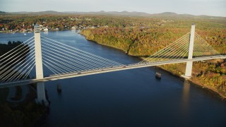 AX149_100 - 5.5K aerial stock footage flying by the Penobscot Narrows Bridge, autumn, Stockton Springs,  Maine