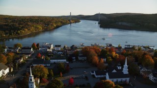 AX149_113 - 5.5K aerial stock footage flying over small town, approach Penobscot Narrows Bridge, autumn, Bucksport, Maine