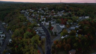 AX149_237 - 5.5K stock footage aerial video of Northern Avenue to Saint Augustine Catholic Church, autumn, Augusta, Maine, twilight