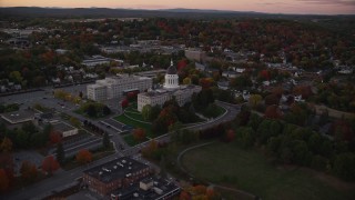 AX149_252E - 5.5K aerial stock footage approaching the Maine State House, autumn, Augusta, Maine, twilight