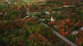 AX150_008 - 5.5K aerial stock footage flying by East Winthrop Baptist Church, Western Avenue, autumn, Winthrop, Maine