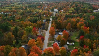 AX150_068 - 5.5K aerial stock footage flying over small town, rural homes, Buckfield Road, autumn, Buckfield, Maine