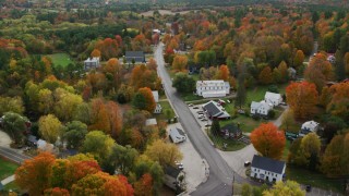 AX150_069 - 5.5K aerial stock footage flying over small town, rural homes, Turner Street, autumn, Buckfield, Maine