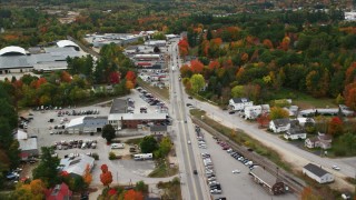 AX150_092 - 5.5K stock footage aerial video flying over Main Street, small rural town, autumn, Paris, Maine