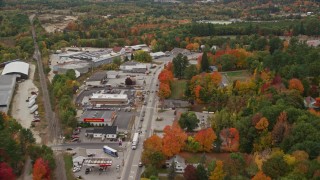 AX150_092E - 5.5K aerial stock footage flying over Main Street, approach Oxford Hills Comprehensive High School, Paris, Maine
