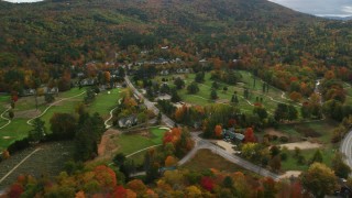 AX150_175 - 5.5K aerial stock footage orbiting Wentworth Golf Club, small rural town, autumn, Jackson, New Hampshire
