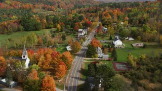AX150_252 - 5.5K stock footage aerial video flying over Sugar Hill Road through small rural town, autumn, Sugar Hill, New Hampshire