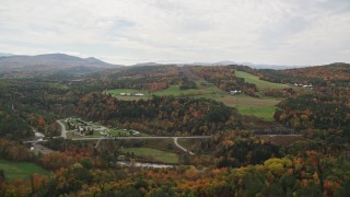AX150_282 - 5.5K aerial stock footage flying by Twin River Campground & Cottages, small farms, autumn, Bath, New Hampshire