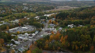 AX150_298 - 5.5K aerial stock footage orbiting small rural towns, Connecticut River, autumn, overcast, Wells River, Vermont