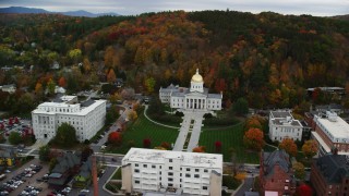 AX150_355 - 5.5K stock footage aerial video orbiting Vermont State House, downtown, autumn, Montpelier, Vermont