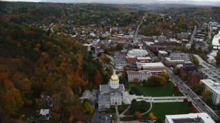 AX150_356 - 5.5K aerial stock footage orbiting Vermont State House in autumn, downtown, Montpelier, Vermont