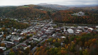 AX150_358 - 5.5K aerial stock footage flying by buildings in downtown, autumn trees, Montpelier, Vermont