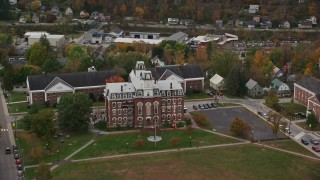 AX150_360 - 5.5K aerial stock footage flying by Vermont College of Fine Arts, autumn, Montpelier, Vermont