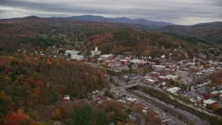 AX150_363 - 5.5K aerial stock footage flying by downtown, Vermont State House from across a river, Montpelier, Vermont