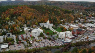 AX150_373 - 5.5K stock footage aerial video flying by downtown, Vermont State House, autumn, Montpelier, Vermont