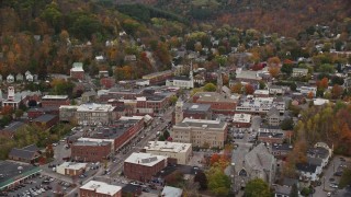 AX150_374 - 5.5K stock footage aerial video flying by Montpelier City Hall, downtown buildings, autumn, Montpelier, Vermont
