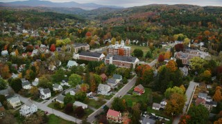 AX150_376 - 5.5K aerial stock footage orbiting Vermont College of Fine Arts, neighborhood, autumn, Montpelier, Vermont