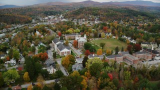 AX150_377 - 5.5K aerial stock footage orbiting Vermont College of Fine Arts, colorful trees, autumn, Montpelier, Vermont