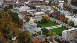 AX150_382 - 5.5K aerial stock footage orbiting Vermont State House, lawns, trees in autumn, Montpelier, Vermont