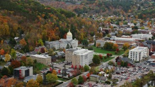 AX150_383 - 5.5K aerial stock footage flying away form Vermont State House, colorful foliage, autumn, Montpelier, Vermont