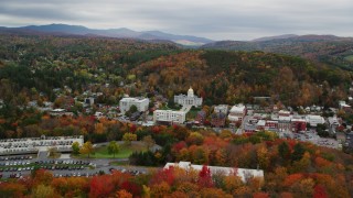 AX150_387 - 5.5K aerial stock footage approaching Vermont State House, buildings, foliage in autumn, Montpelier, Vermont