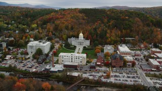 AX150_388 - 5.5K aerial stock footage approaching Vermont State House, downtown, colorful trees in autumn, Montpelier, Vermont