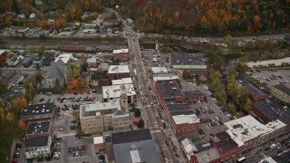 AX150_391 - 5.5K aerial stock footage tilting down, fly by St. Augustine's Catholic Church, Montpelier City Hall, autumn, Montpelier, Vermont