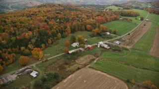 AX150_409 - 5.5K aerial stock footage flying by Boudro Road, rural farms, foliage in autumn, Randolph Center, Vermont