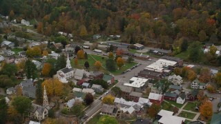 AX150_446 - 5.5K stock footage aerial video orbiting church, town square, small rural town in autumn, South Royalton, Vermont