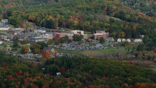 AX150_472 - 5.5K aerial stock footage flying by White River Junction VA Medical Center, autumn, White River Junction, Vermont